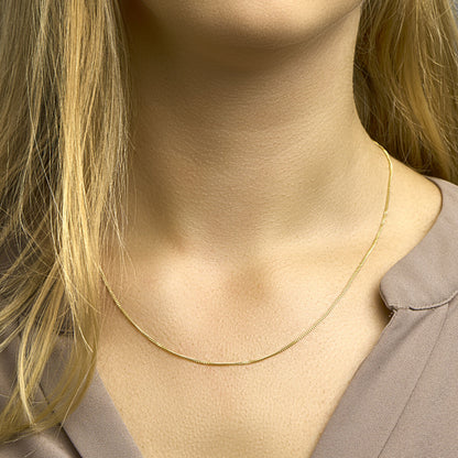 Gouden gourmette ketting 1,2 mm – 14 karaat – zijaanzicht