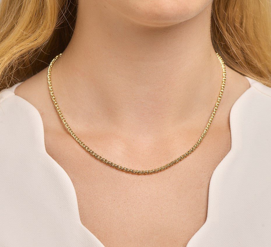 Gouden draadschakelketting met zilveren kern